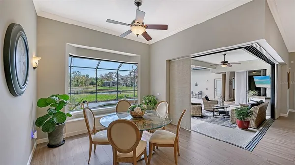 a bedroom with a bed a window and a chandelier