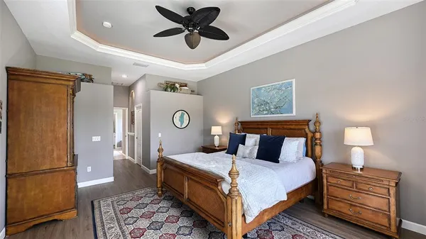 a spacious bathroom with a granite countertop sink mirror and shower