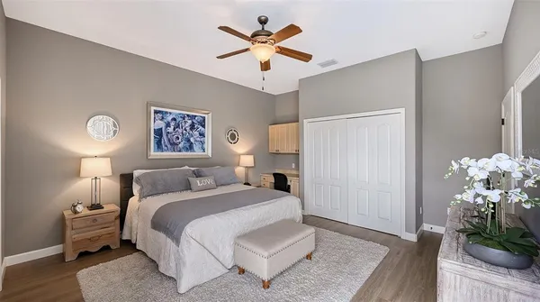 a bedroom with a bed and a dresser