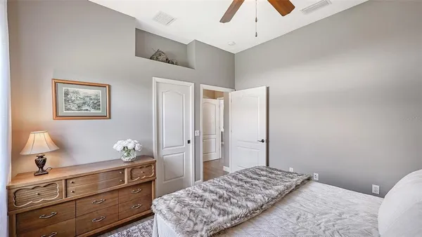 a view of a workspace with furniture and wooden floor