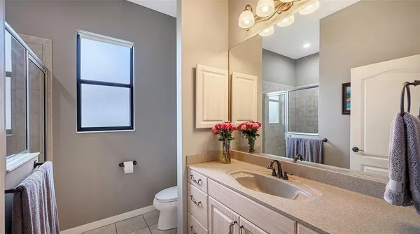 a living room with patio floor to ceiling windows and a table