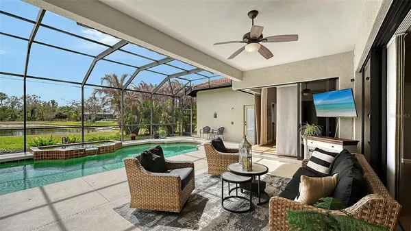 a view of a house with backyard porch and sitting area
