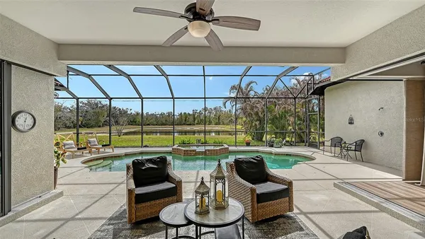 a view of a patio with a table and chairs
