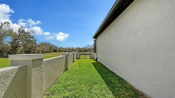 an aerial view of a house with a swimming pool yard and outdoor seating