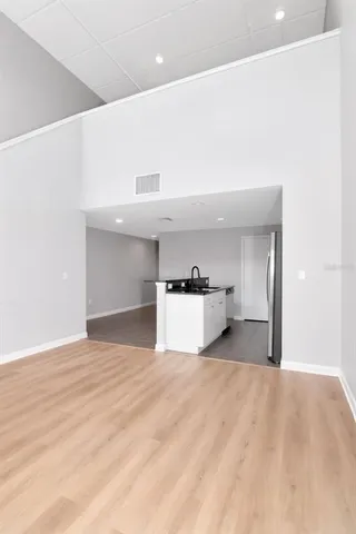 a view of a kitchen with microwave and cabinets