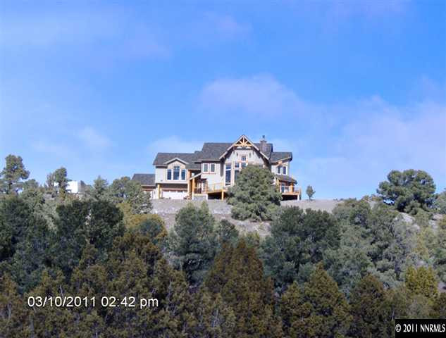 2620 Castle Peak Road Reno, NV 89521 - Photo 1 of 10 a front view of a house with a yard