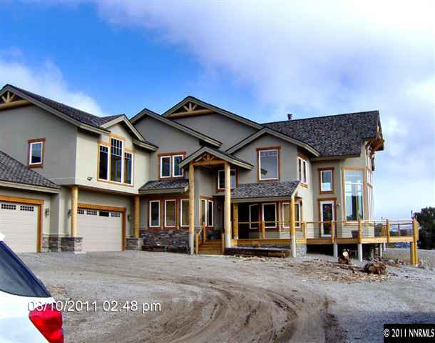 2620 Castle Peak Road Reno, NV 89521 - Photo 3 of 10 a backyard of a house with yard fire pit and outdoor seating
