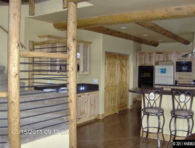 2620 Castle Peak Road Reno, NV 89521 - Photo 7 of 10 a view of a hallway with chairs and wooden floor