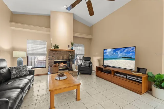 a living room with furniture a window and a fireplace