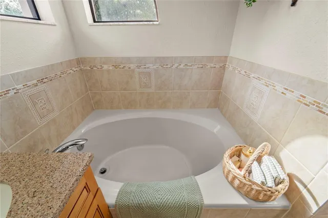 a bathroom with double sink and a mirror