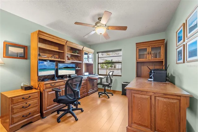 a bathroom with a granite countertop sink a toilet and a mirror