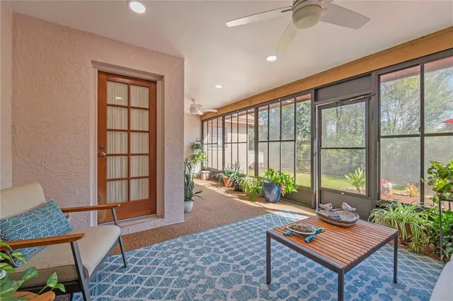 a living room with furniture and a rug