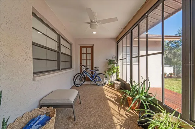 a view of a house with swimming pool and sitting area