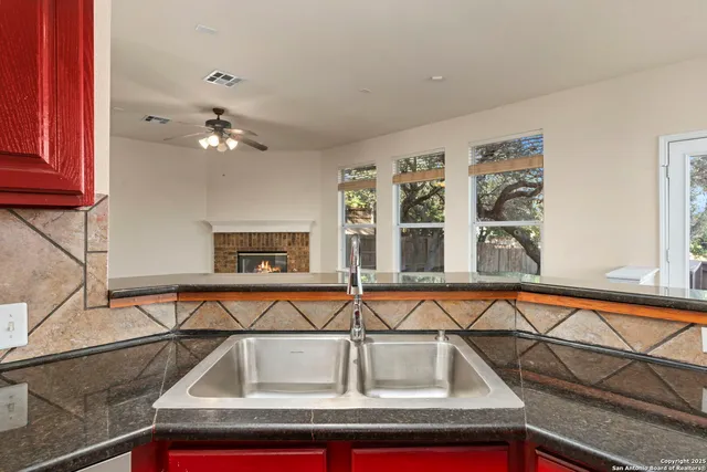 a living room with furniture and painting on the wall