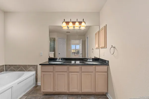 a bathroom with a sink and a bathtub