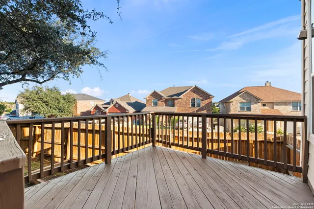 a view of balcony with wooden floor