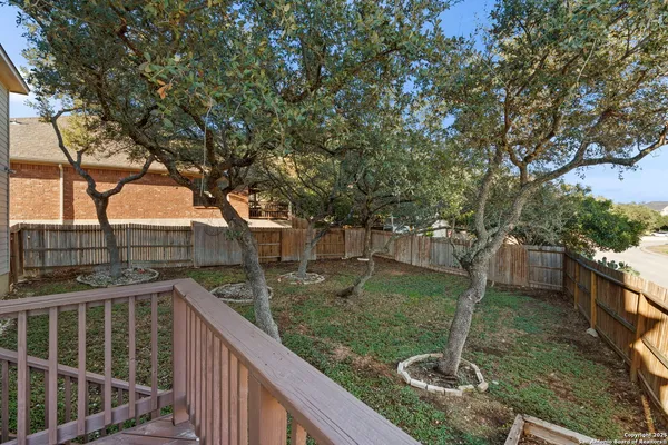 a view of a garden from a balcony