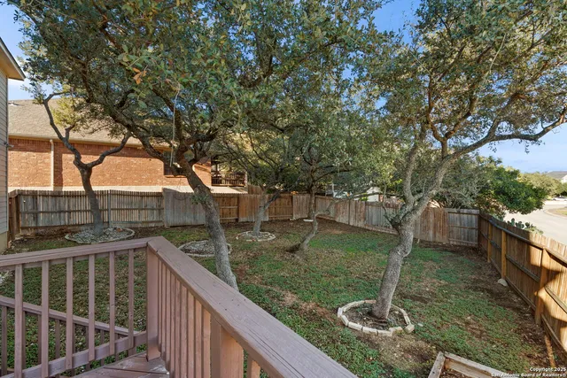 a view of a garden from a balcony