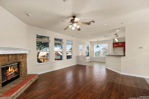 a view of an empty room with fire place and a fireplace