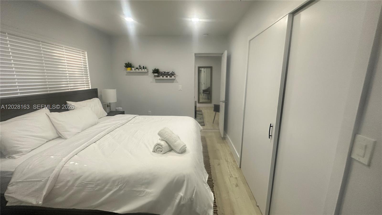 4290 Southwest 9th Street, Unit B Miami, FL 33134 - Photo 13 of 18 a bedroom with a bed and a window