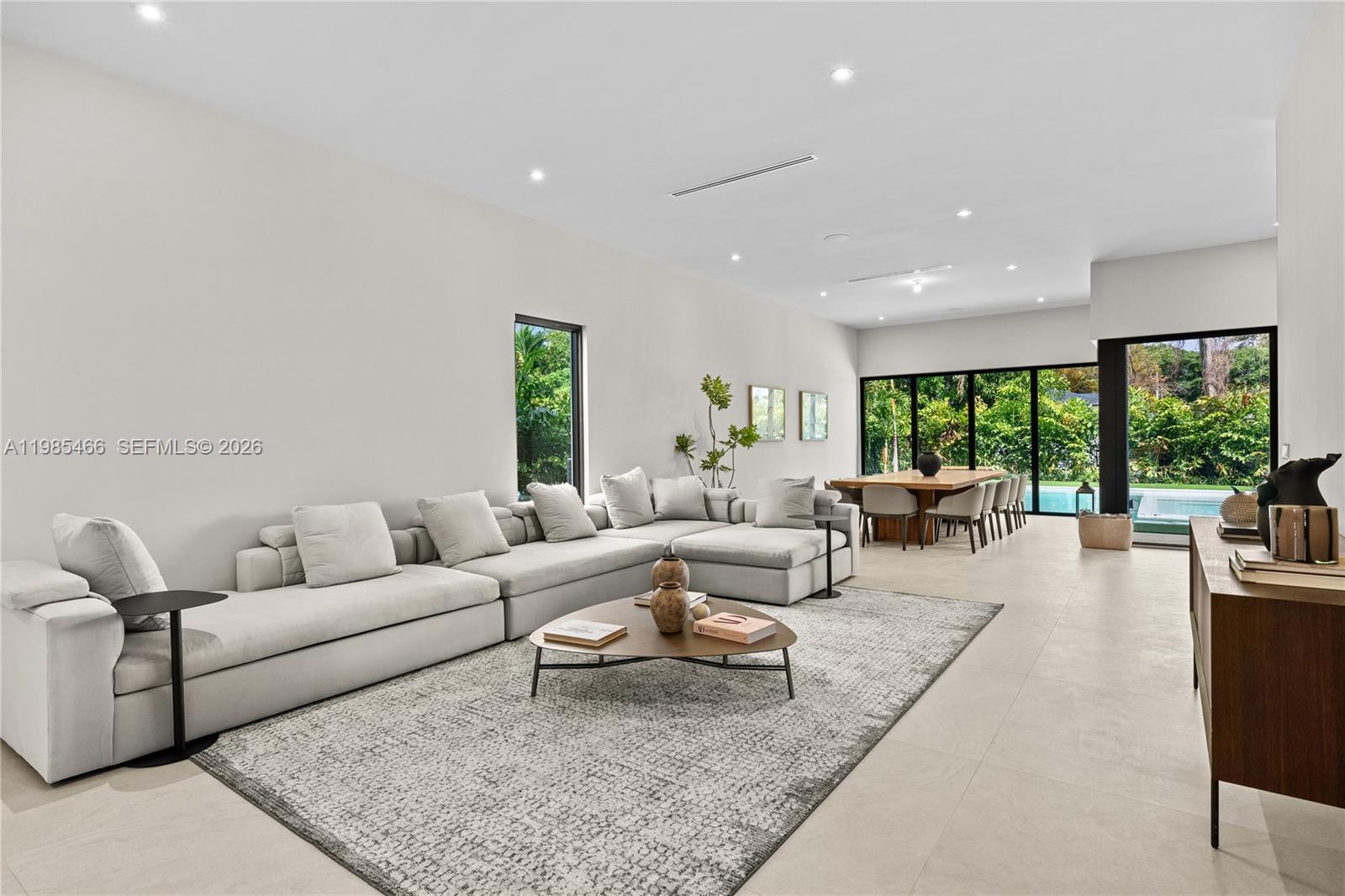 245 Northeast 116th Street Miami, FL 33161 - Photo 16 of 48 a living room with furniture and a large window