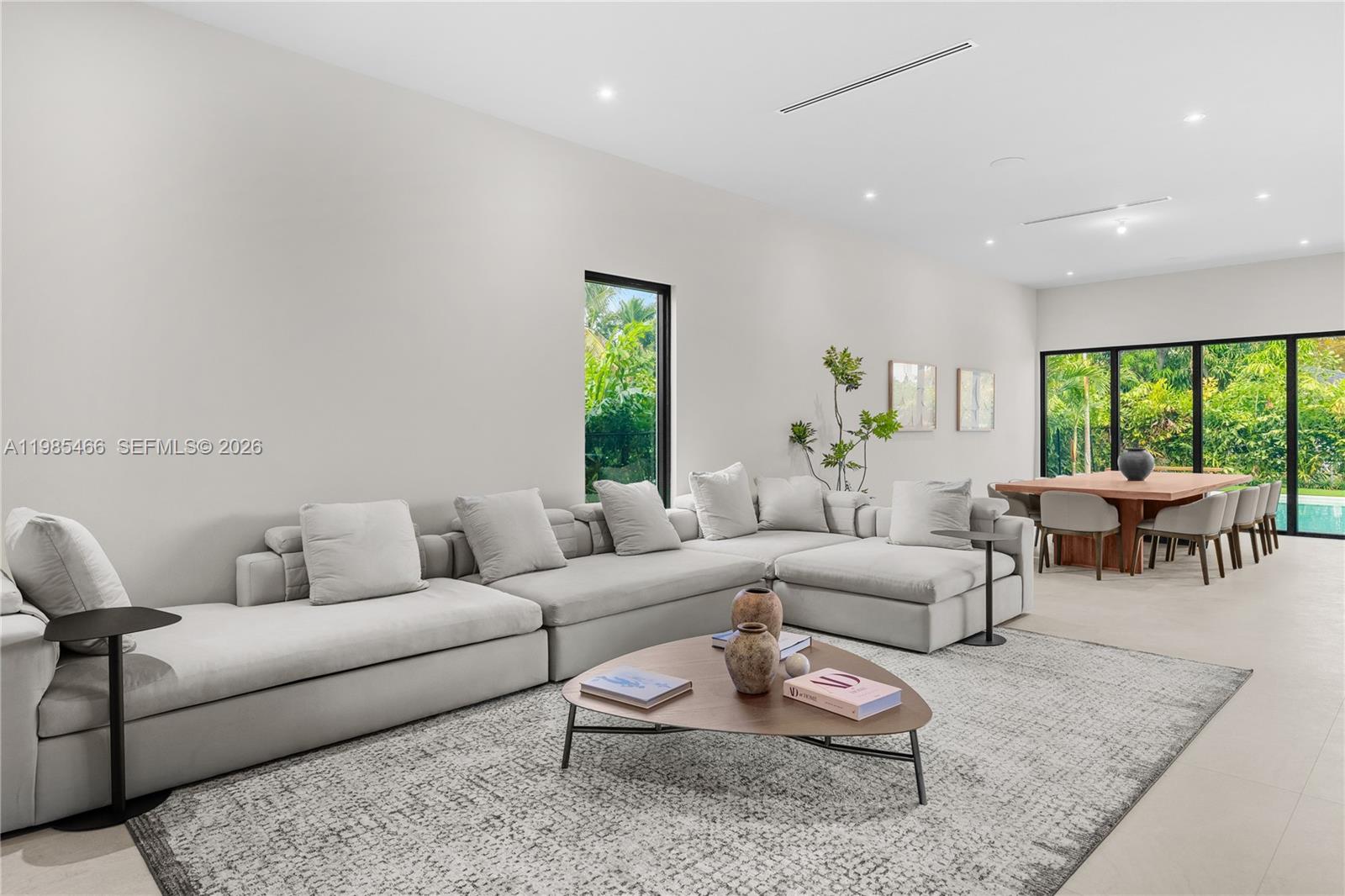 245 Northeast 116th Street Miami, FL 33161 - Photo 18 of 48 a living room with furniture and a large window