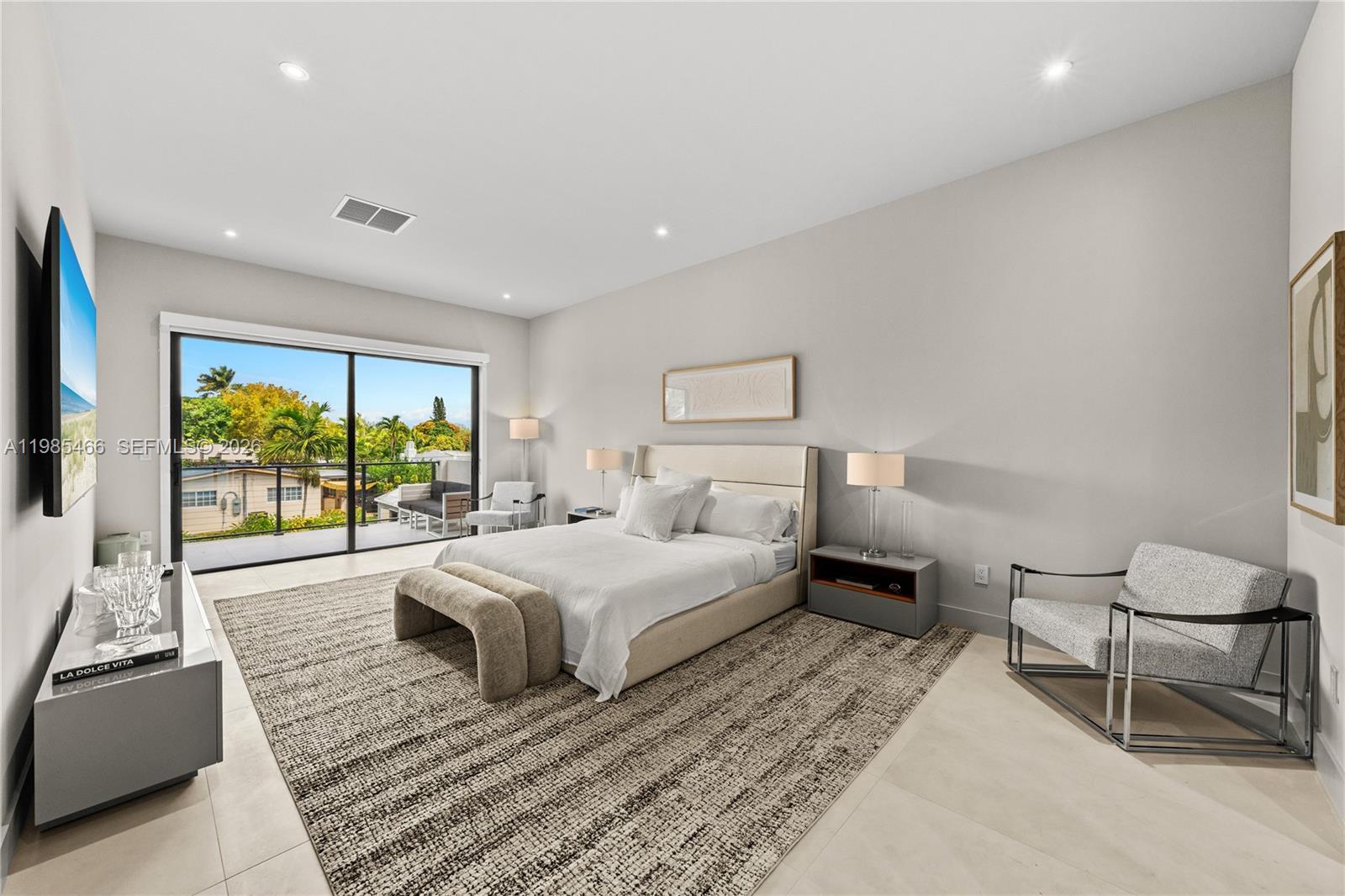 245 Northeast 116th Street Miami, FL 33161 - Photo 22 of 48 a bedroom with a bed and a large window
