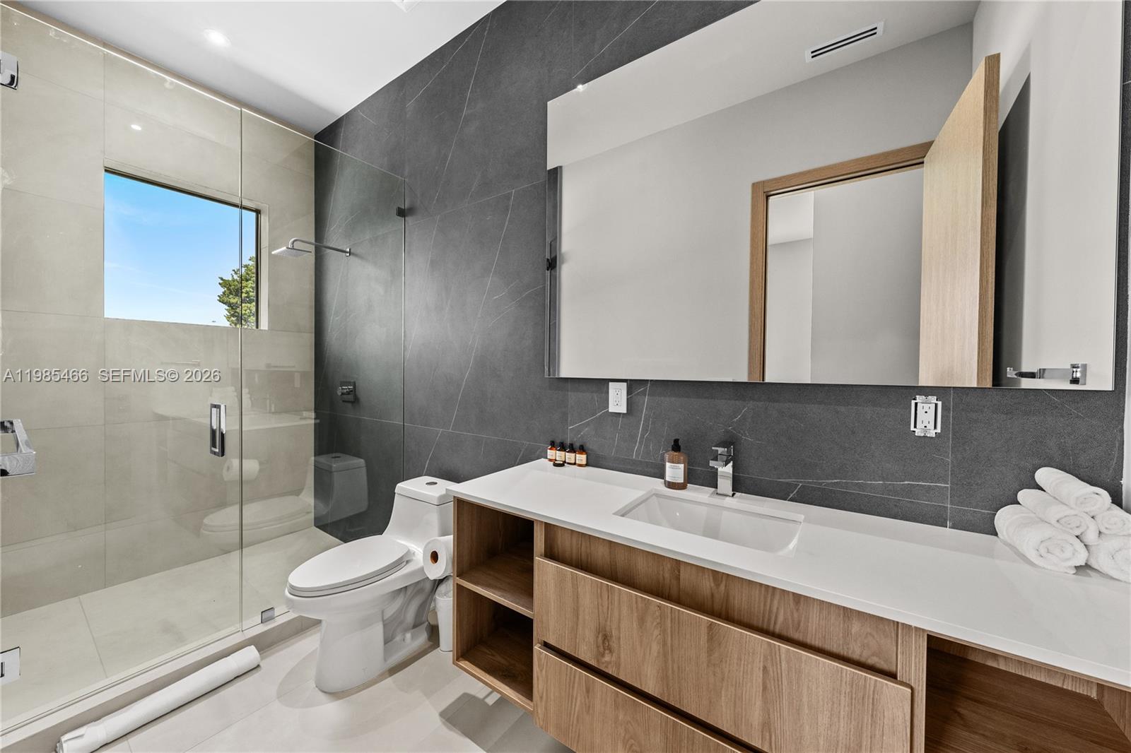 245 Northeast 116th Street Miami, FL 33161 - Photo 31 of 48 a bathroom with a sink toilet and shower