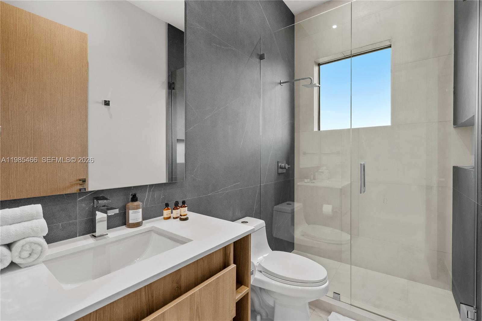 245 Northeast 116th Street Miami, FL 33161 - Photo 39 of 48 a bathroom with a sink toilet vanity and shower