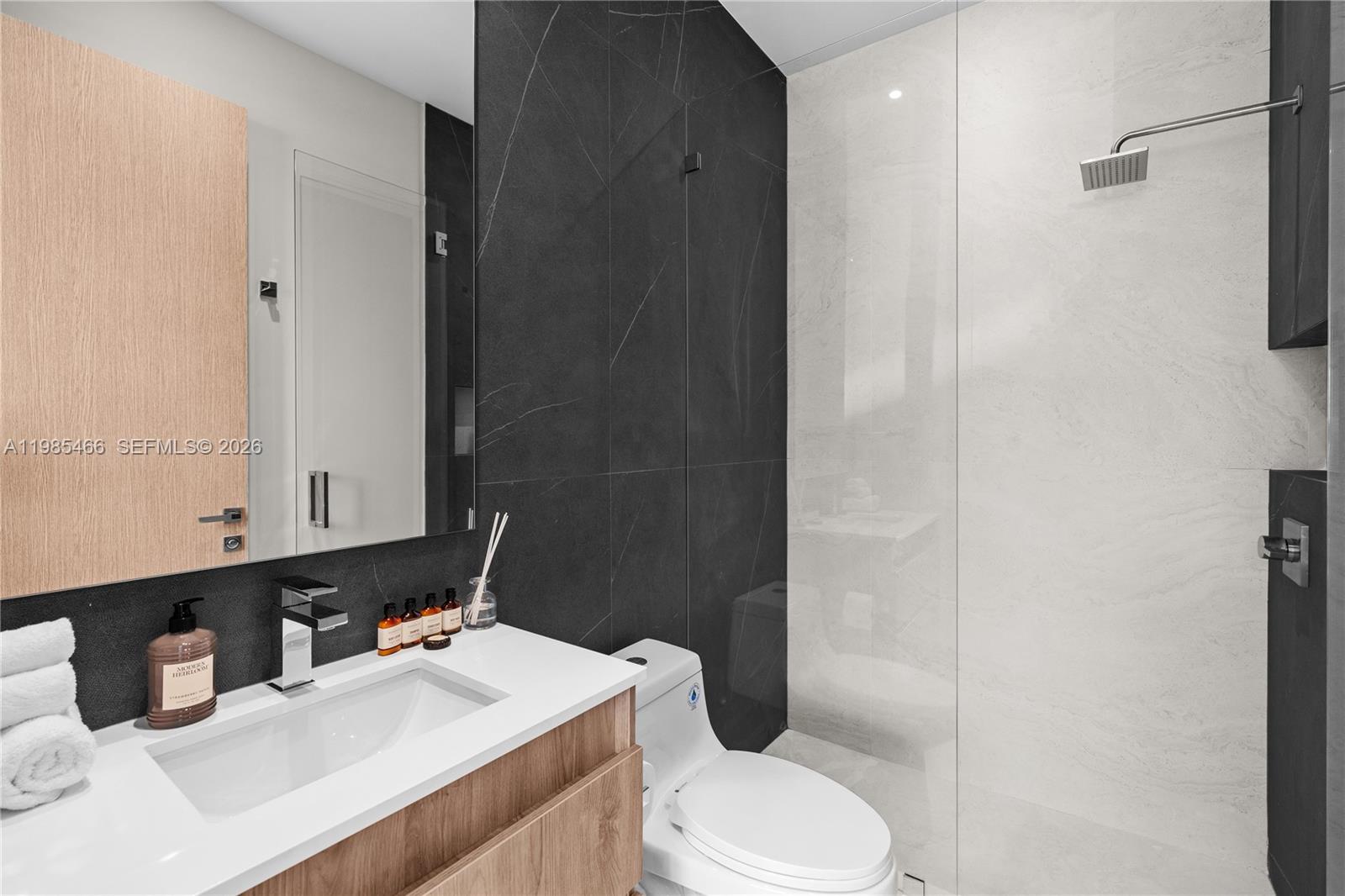 245 Northeast 116th Street Miami, FL 33161 - Photo 41 of 48 a bathroom with a sink a toilet and shower