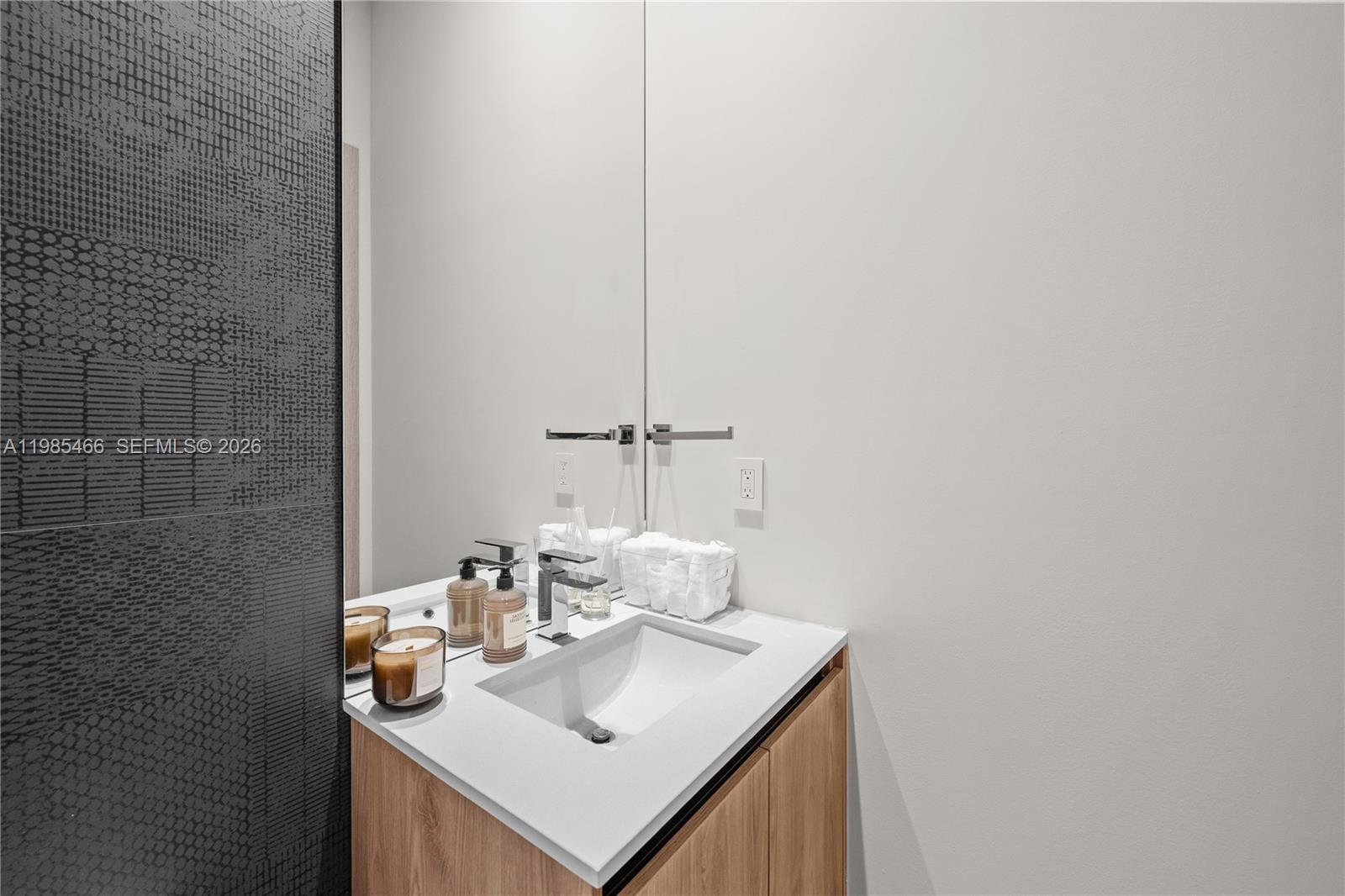 245 Northeast 116th Street Miami, FL 33161 - Photo 42 of 48 a bathroom with a sink and a mirror