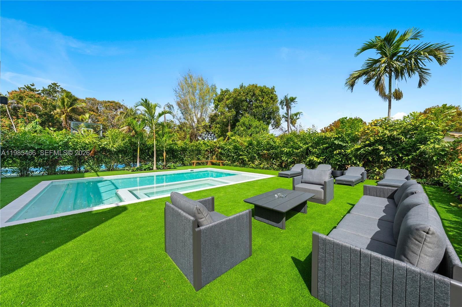 245 Northeast 116th Street Miami, FL 33161 - Photo 7 of 48 a view of a yard with swimming pool and outdoor seating