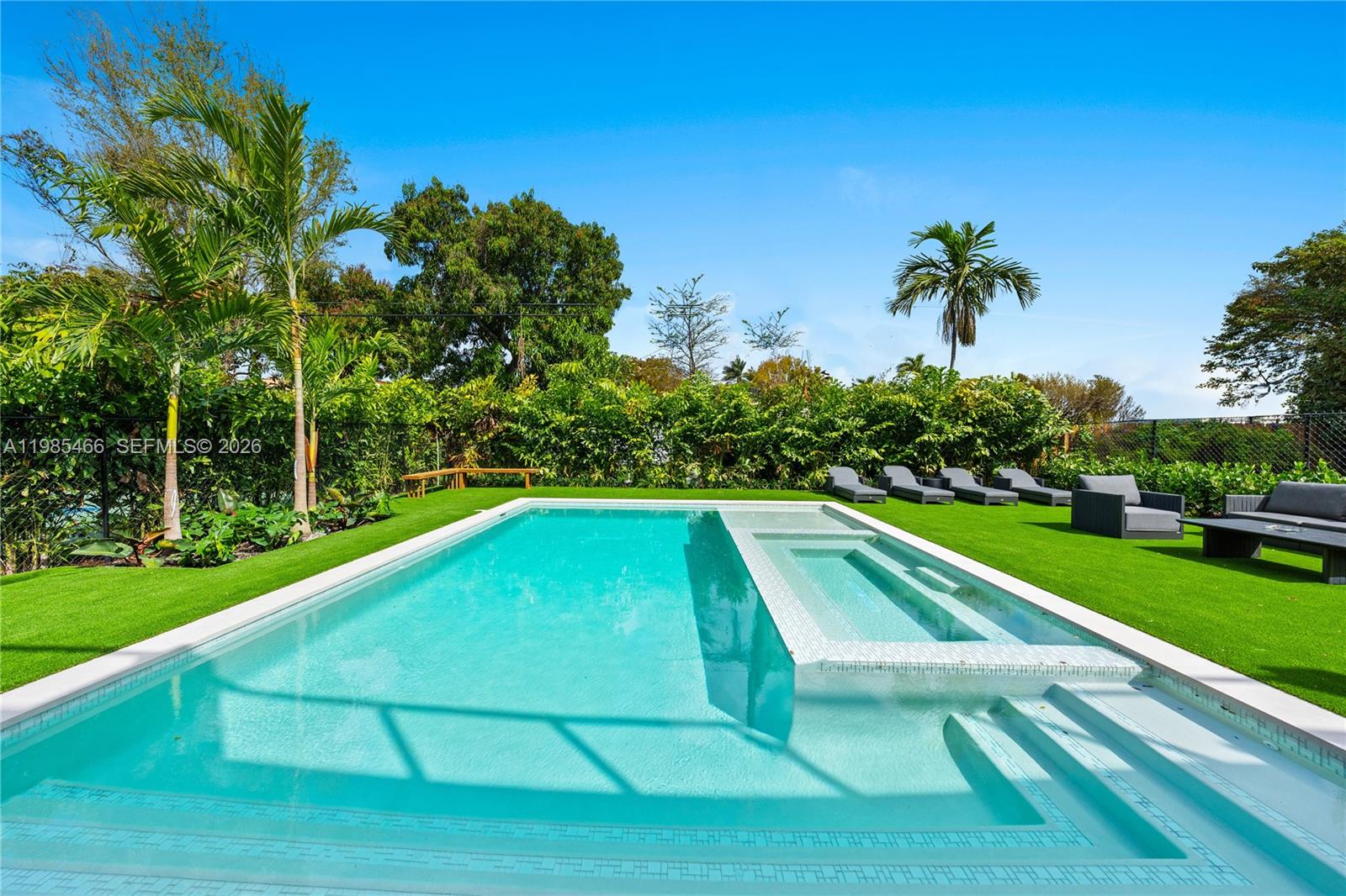 245 Northeast 116th Street Miami, FL 33161 - Photo 8 of 48 a view of a backyard with a swimming pool