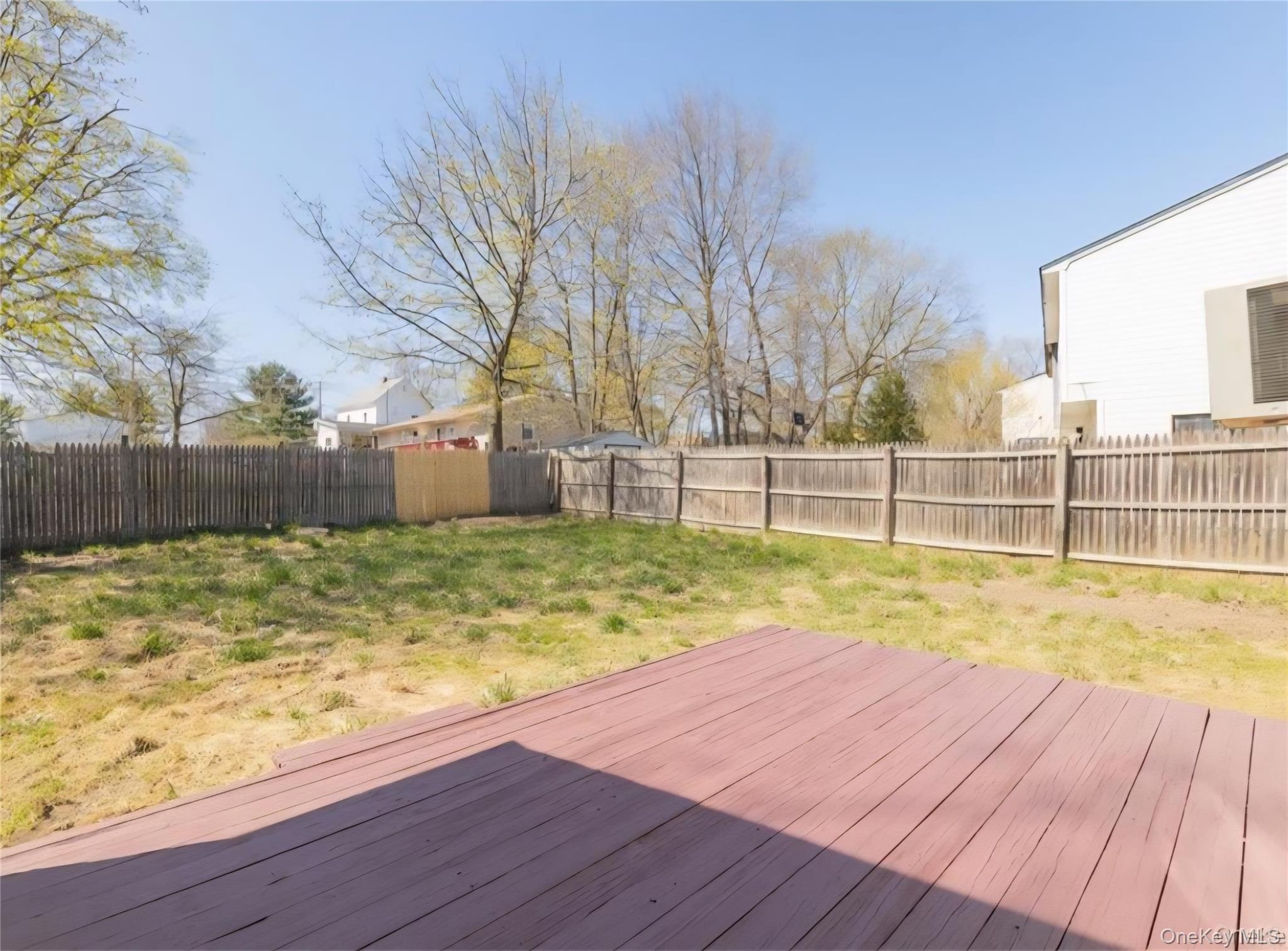 41 Albacon Road Nanuet, NY 10954 - Photo 5 of 6 Wooden deck with a fenced backyard