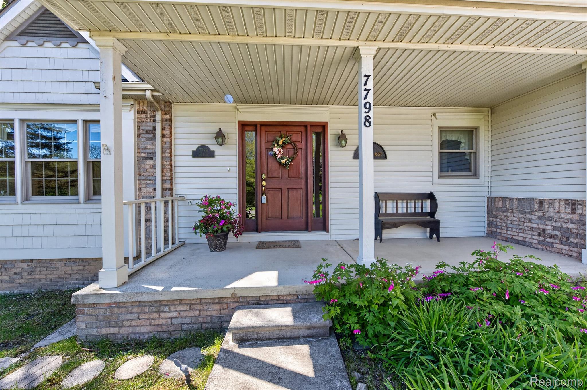 7798 Lee Road Brighton, MI 48116 - Photo 47 of 49 Property entrance featuring a porch