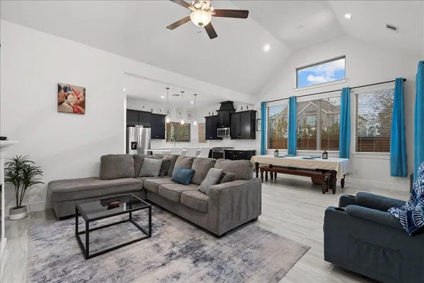 a living room with furniture and a large window