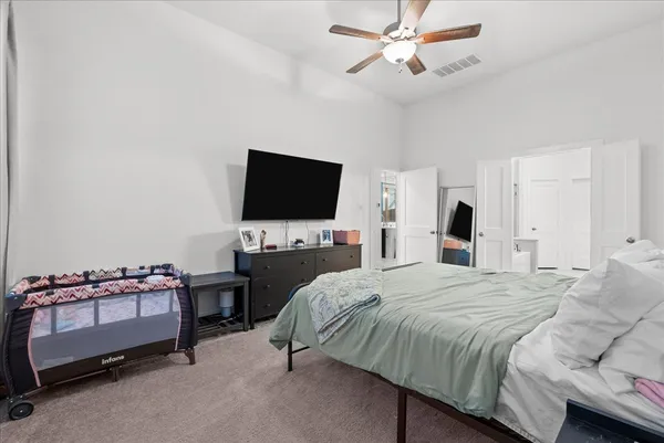 a spacious bathroom with a tub sink shower and mirror