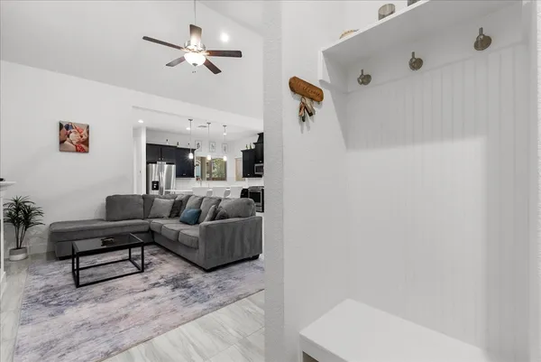 a view of a yard with a wooden fence