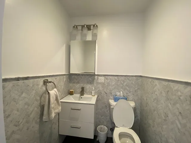 a bathroom with a sink and mirror