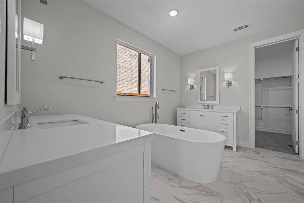 11549 Wulstone Road Fort Worth, TX 76052 - Photo 13 of 35 a bathroom with a sink a toilet and shower