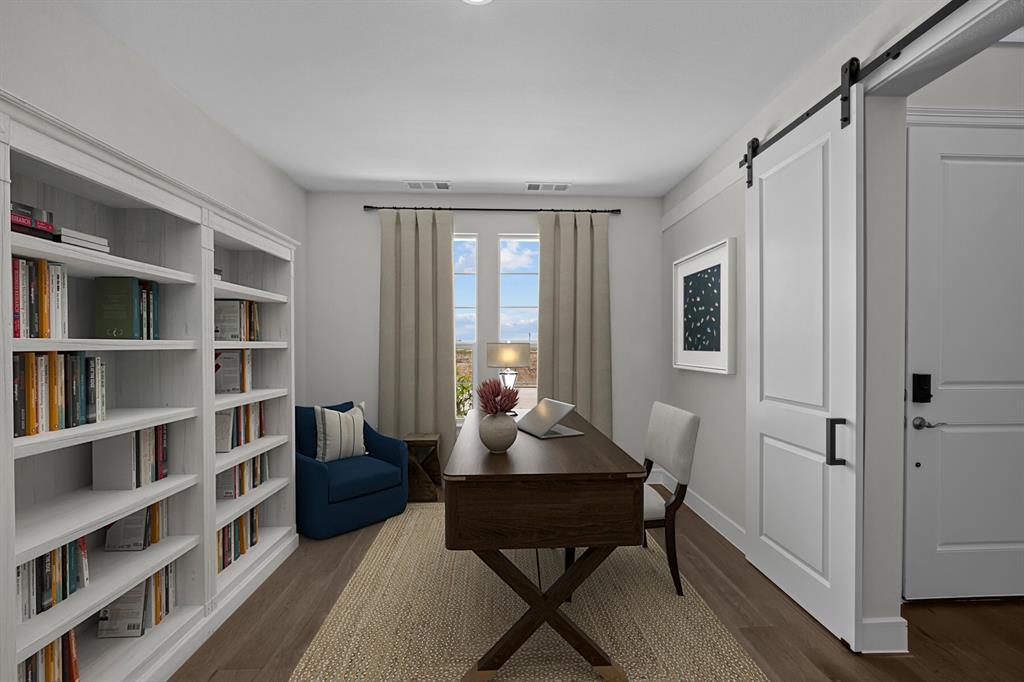 11549 Wulstone Road Fort Worth, TX 76052 - Photo 16 of 35 a living room with furniture and a book shelf