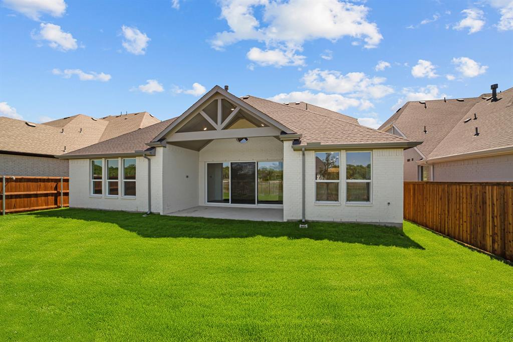 11549 Wulstone Road Fort Worth, TX 76052 - Photo 25 of 35 a view of a house with a garden