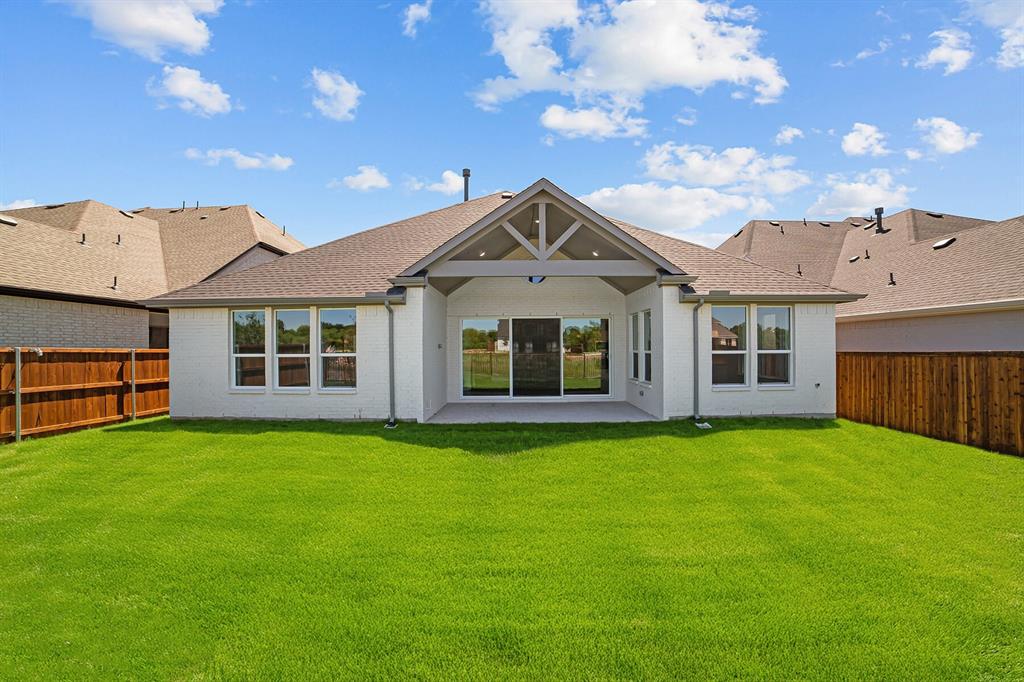 11549 Wulstone Road Fort Worth, TX 76052 - Photo 27 of 35 a front view of a house with a garden