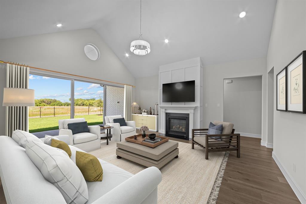 11549 Wulstone Road Fort Worth, TX 76052 - Photo 4 of 35 a living room with furniture fireplace and a flat screen tv