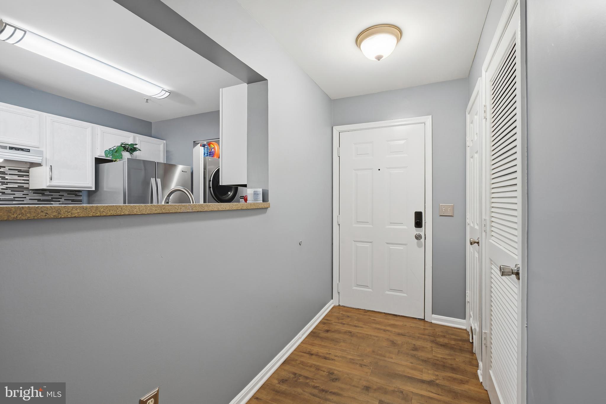 14151 Cuddy Loop, Unit 101 Woodbridge, VA 22193 - Photo 23 of 45 a view of a hallway with closet and bathroom
