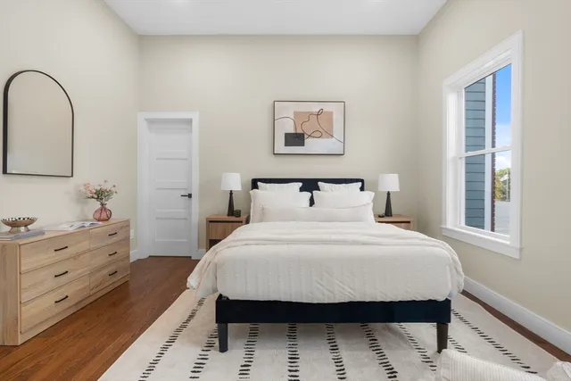 a bedroom with a bed and a dresser