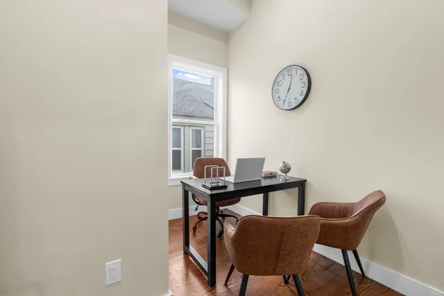 a view of a room with a table and a chair
