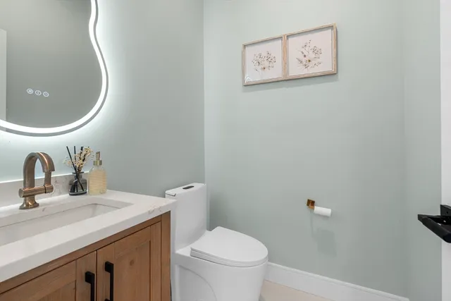 a bathroom with a toilet and a sink