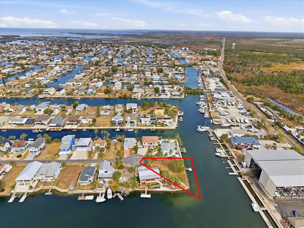 4064 Casa Court Hernando Beach, FL 34607 - Photo 14 of 32 an aerial view of residential building with parking space