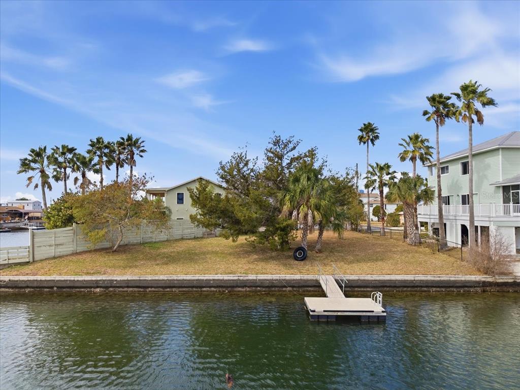 4064 Casa Court Hernando Beach, FL 34607 - Photo 17 of 32 a view of a water with boats and trees in the background